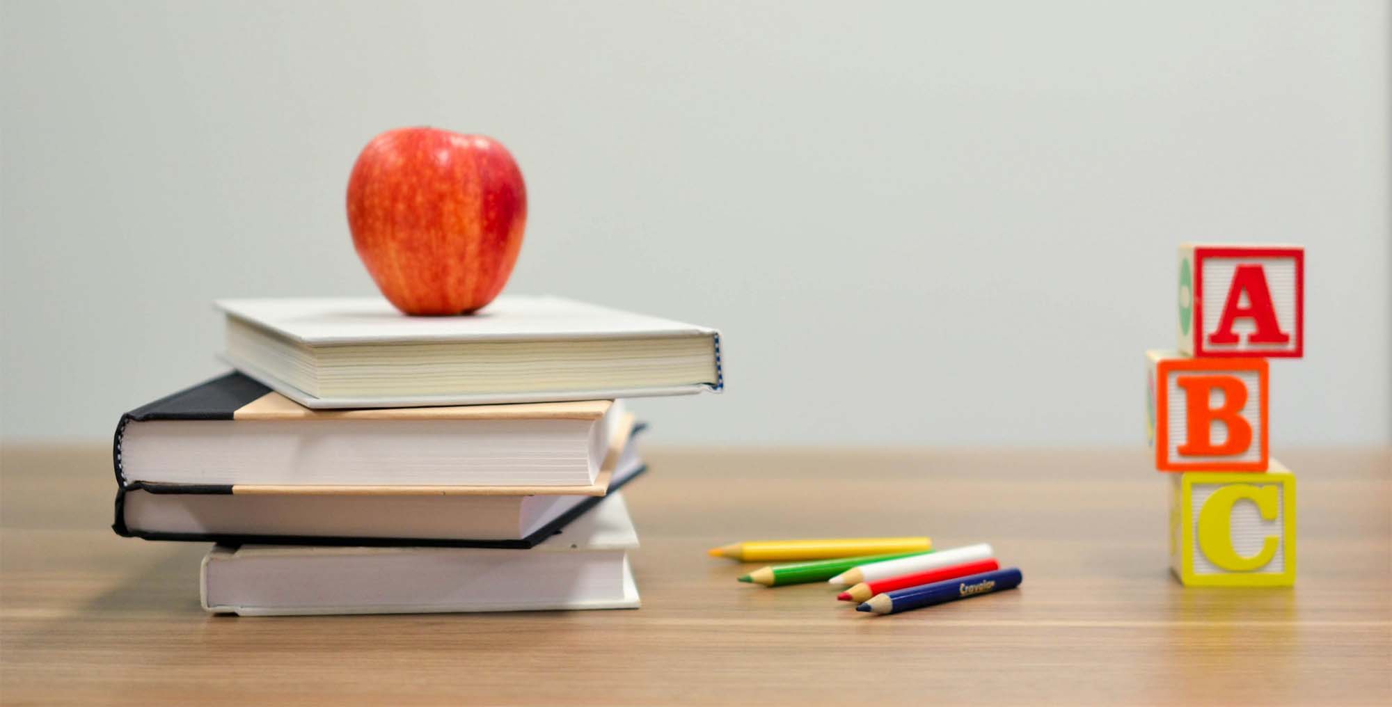 Several school items sit on a table